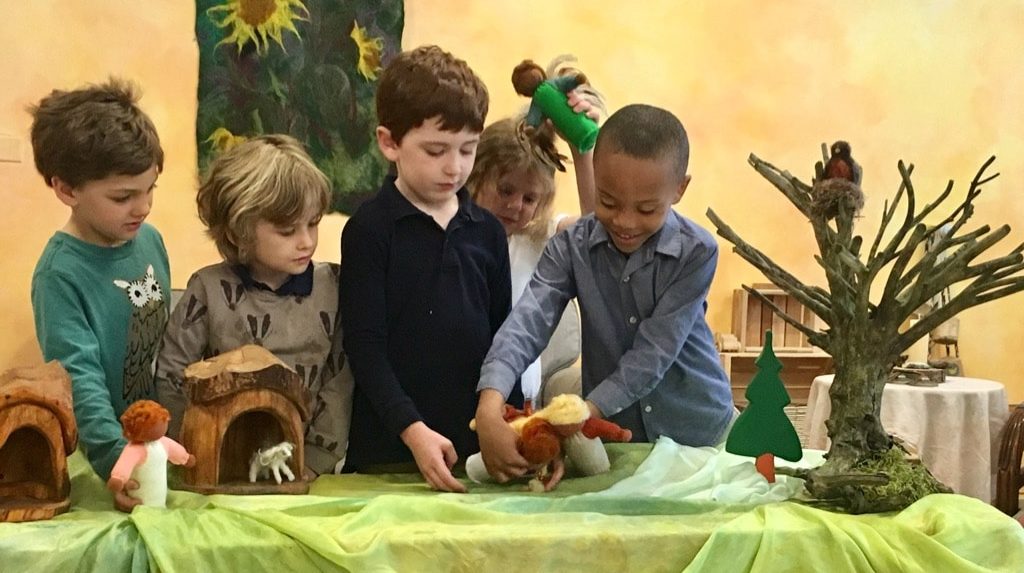A group of 6 Urban Prairie Waldorf Early Childhood students use their imagination and creativity to stage a puppet show.